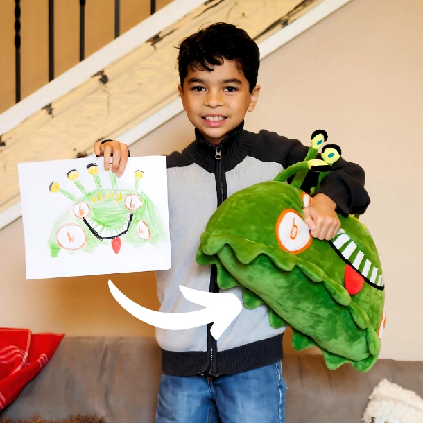 Happy kids holding the drawing and a custom plushie made out of it by Child's Own Studio